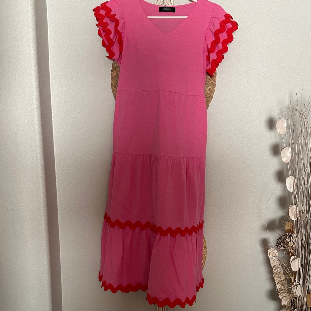 Pink dress with rickrack and ruffle sleeves